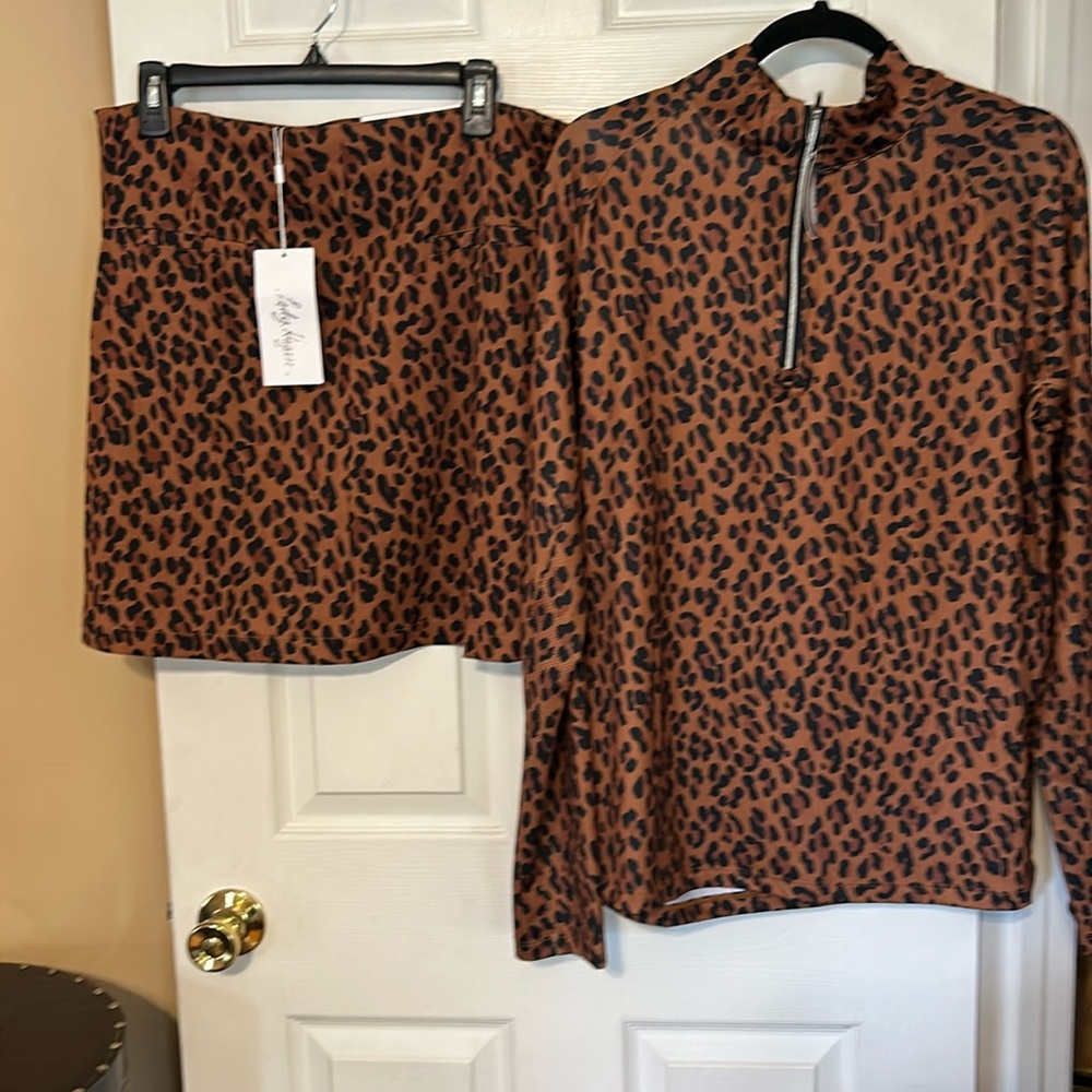 Brand new skirt/shorts with the matching top